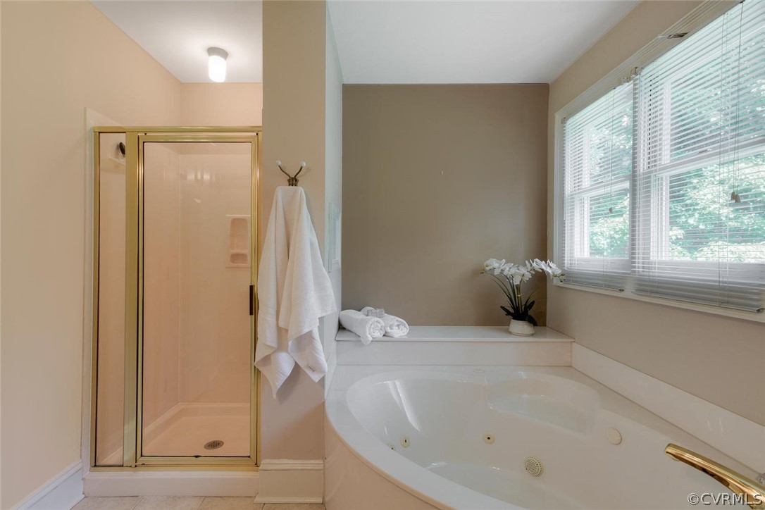 9211 Cattail Road Chesterfield, VA 23838 - Photo 21 of 37 a bathroom with a tub shower and window