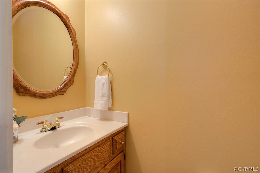 9211 Cattail Road Chesterfield, VA 23838 - Photo 23 of 37 a bathroom with a sink and a mirror