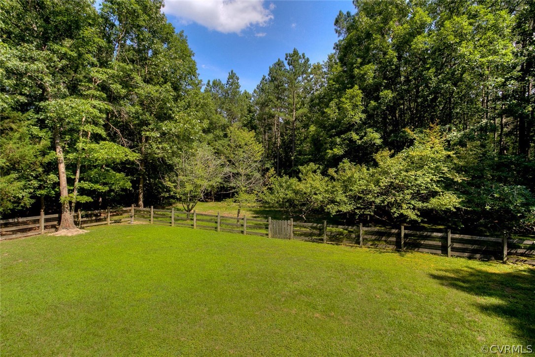 9211 Cattail Road Chesterfield, VA 23838 - Photo 32 of 37 a view of a tennis ground with large trees