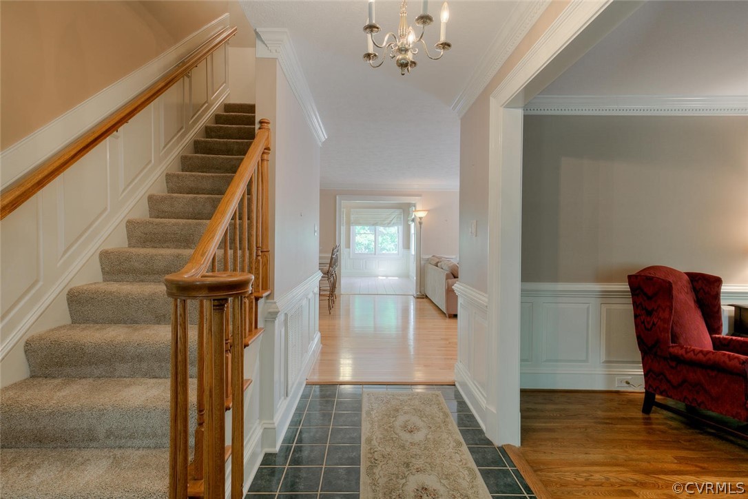 9211 Cattail Road Chesterfield, VA 23838 - Photo 5 of 37 a view of a hallway to a livingroom with furniture and stairs