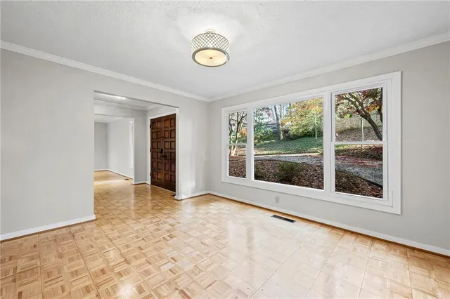 a view of an empty room with a window