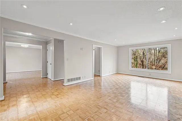 a view of an empty room with a window