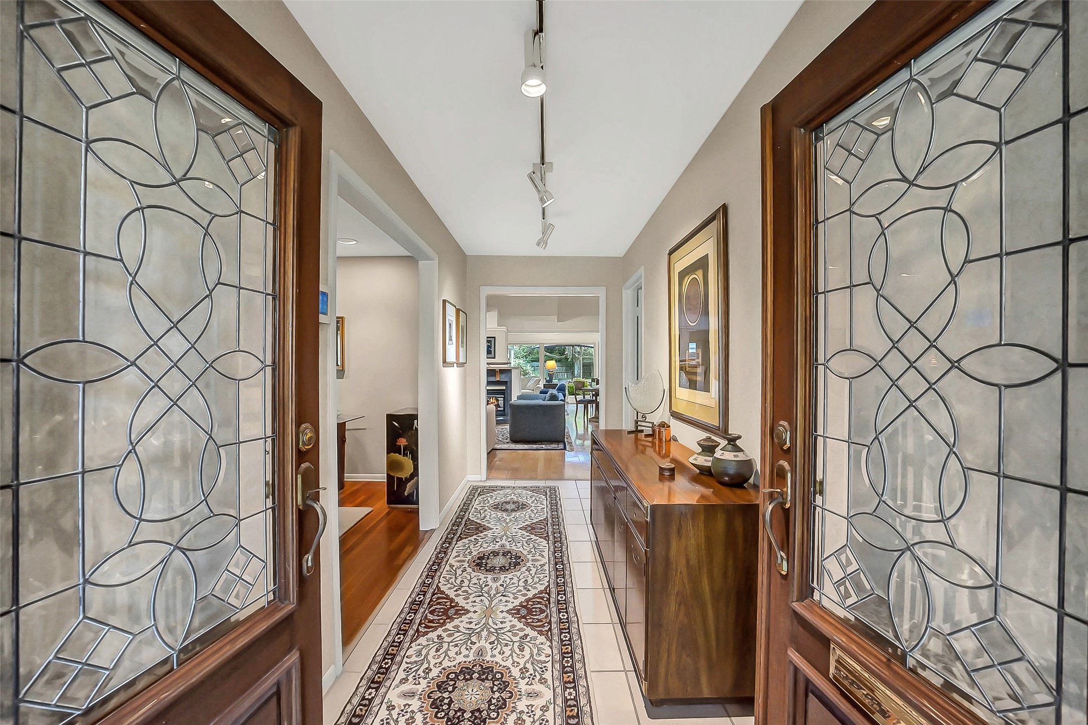 5626 Hummingbird Street Houston, TX 77096 - Photo 4 of 34 Through leaded glass inset mahogany double doors, one enters into this pristinely cared for home which has been lovingly expanded, renovated, and updated over the years showing great pride of ownership.
