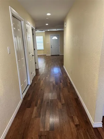 a view of entryway with wooden floor