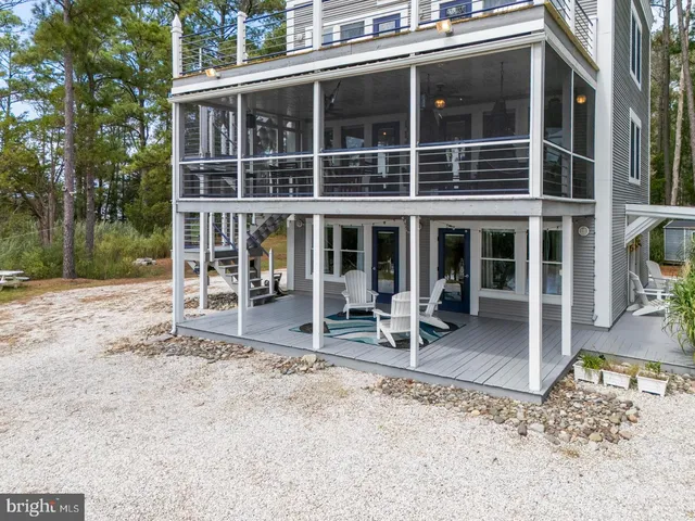 a view of a house with a large window and table