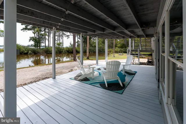 a view of a deck with wooden floor and outdoor space