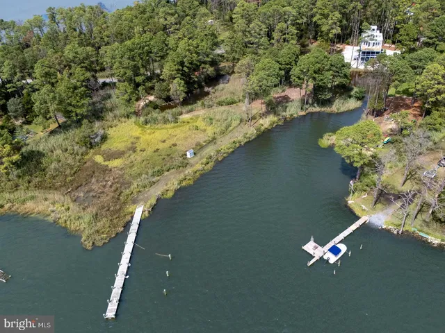 an aerial view of house with yard