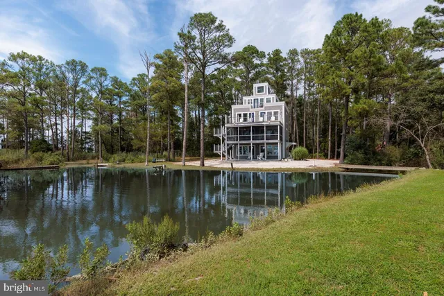 a view of a lake with a house in the background