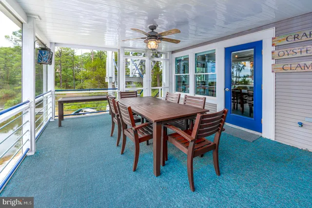 a view of a patio with a table and chairs
