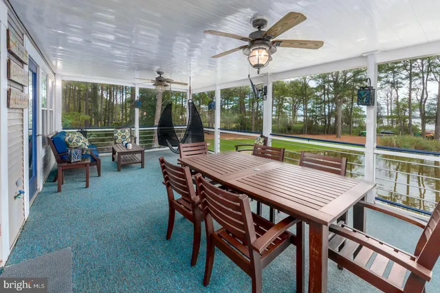 a view of a bathroom with a sink and mirror