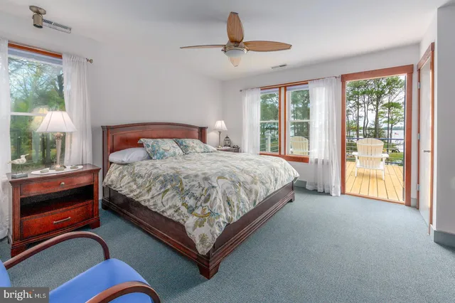a bathroom with a sink toilet and a window