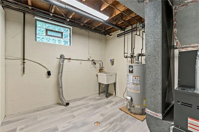 a bathroom with a shower and a sink