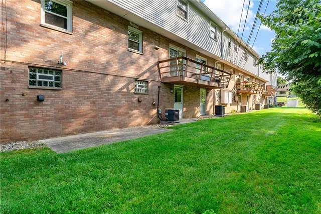 a view of a building with a yard