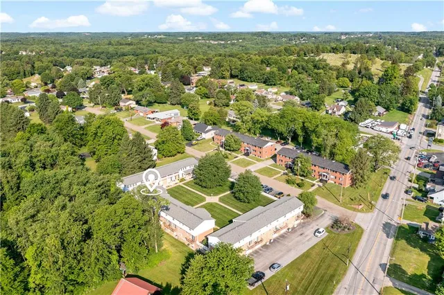 an aerial view of residential houses with outdoor space