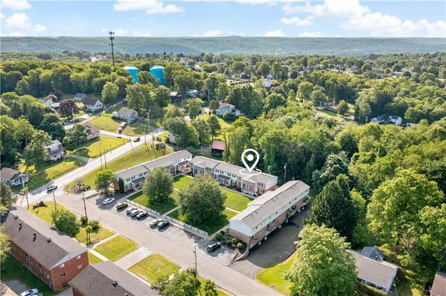an aerial view of a house with a garden