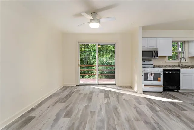 a view of cabinets and wooden floor