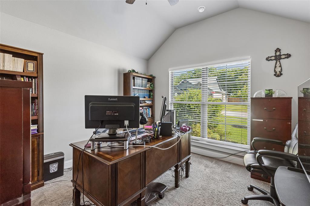 108 Maverick Lane Pilot Point, TX 76258 - Photo 24 of 27 Spacious room featuring vaulted ceilings, a large window with blinds, and built-in shelving