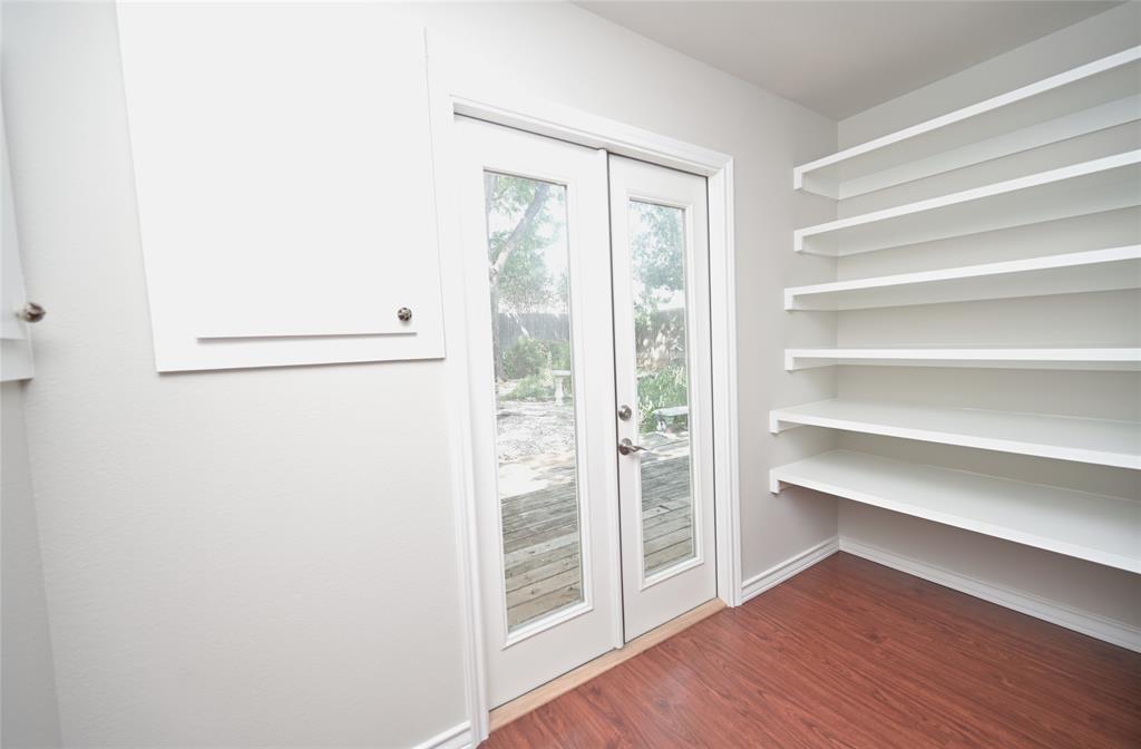 4649 Misty Ridge Drive Fort Worth, TX 76137 - Photo 19 of 40 Double doors to backyard & side built-ins