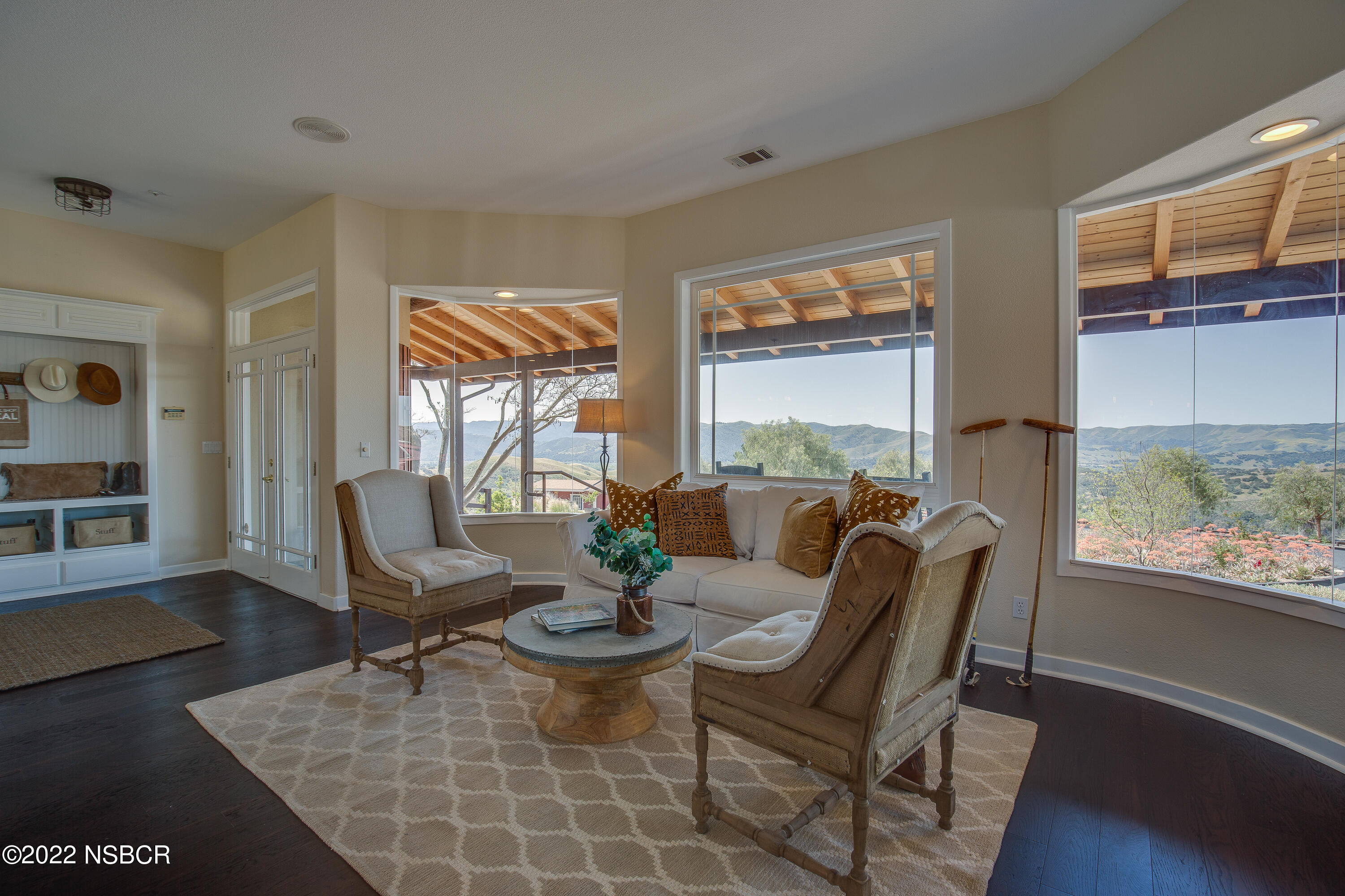 1833 Cougar Ridge Road Buellton, CA 93427 - Photo 12 of 46 a view of a dining room with furniture window and wooden floor