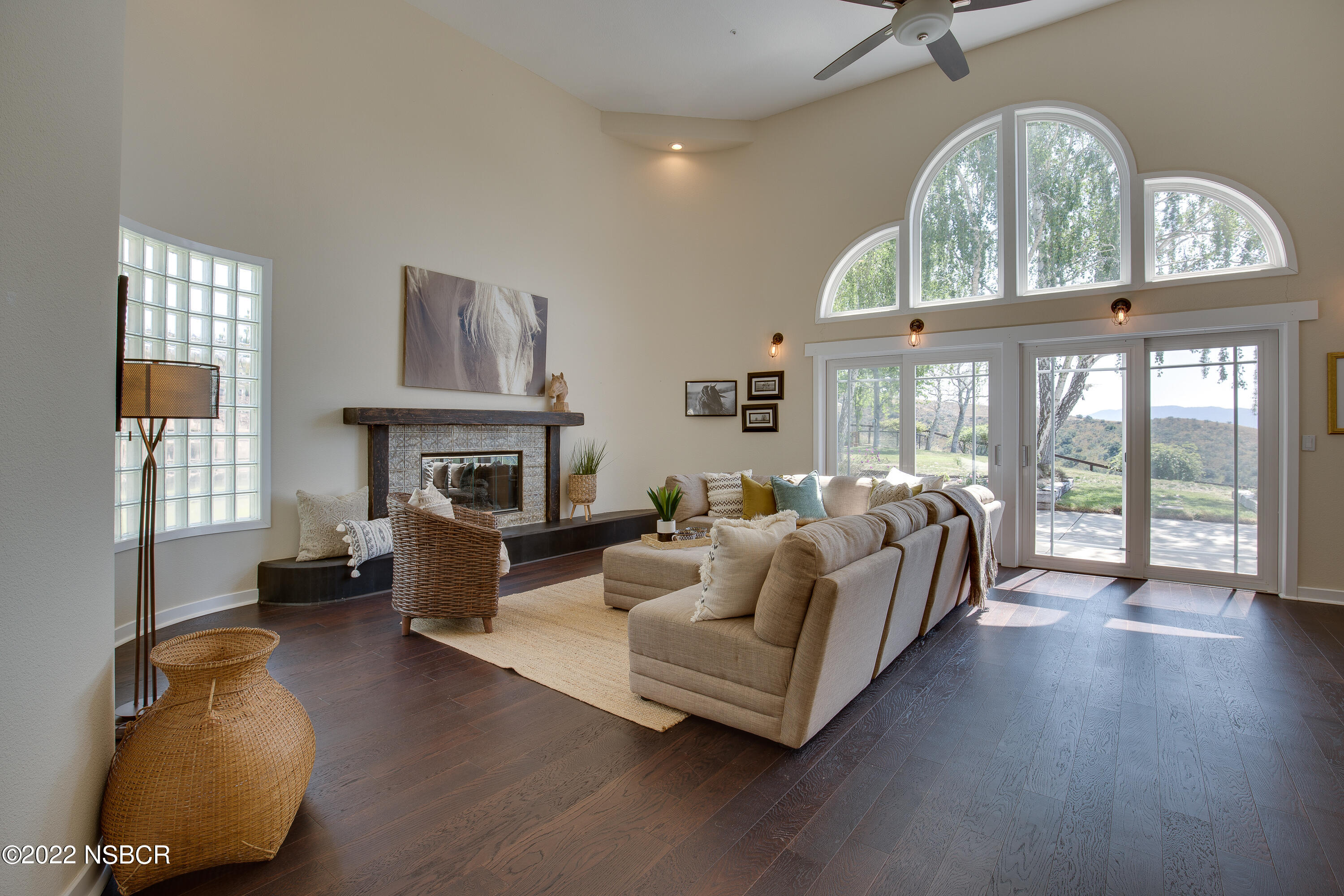 1833 Cougar Ridge Road Buellton, CA 93427 - Photo 16 of 46 a living room with furniture fireplace and a large window