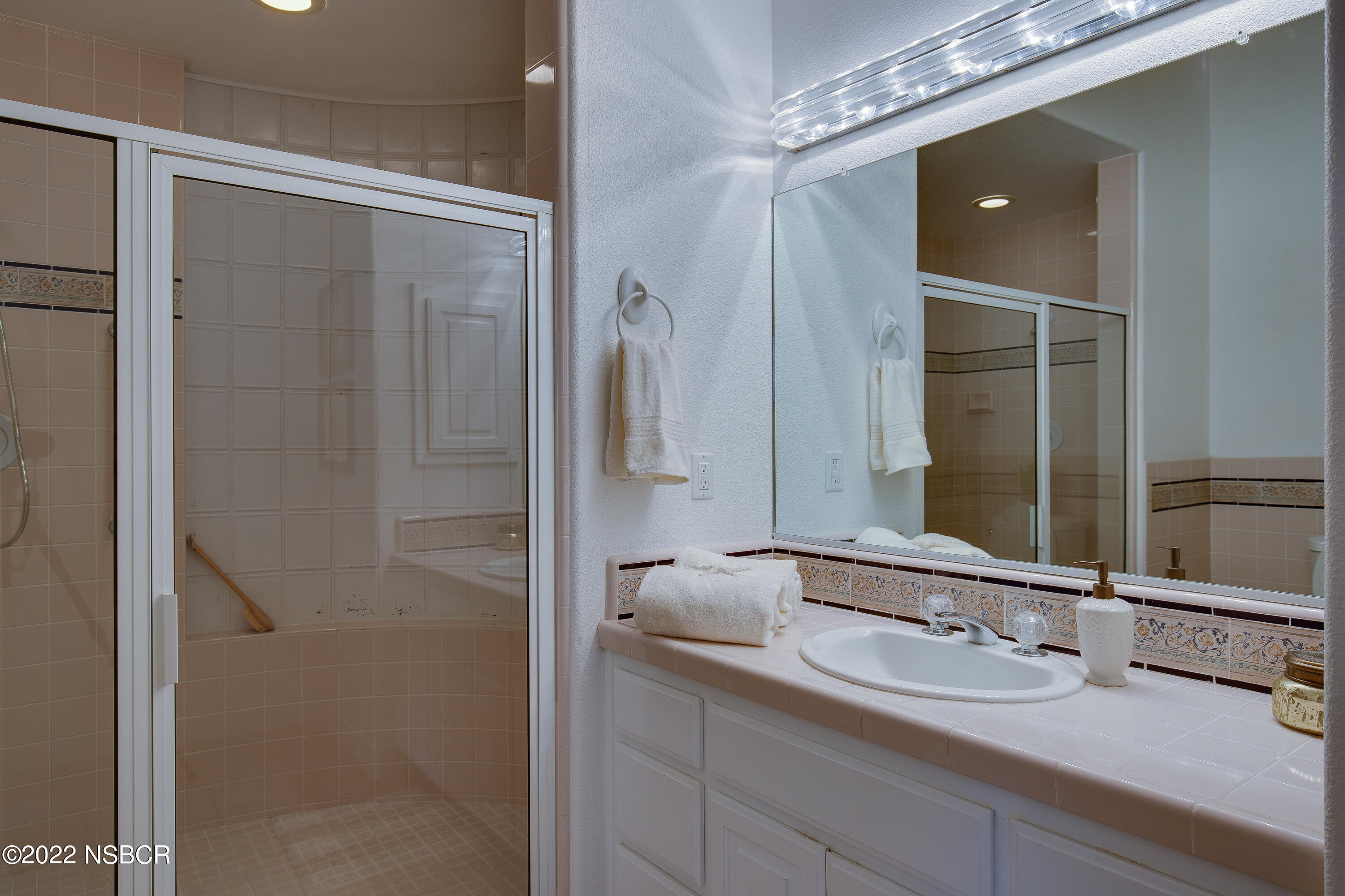 1833 Cougar Ridge Road Buellton, CA 93427 - Photo 20 of 46 a bathroom with a double vanity sink mirror and shower