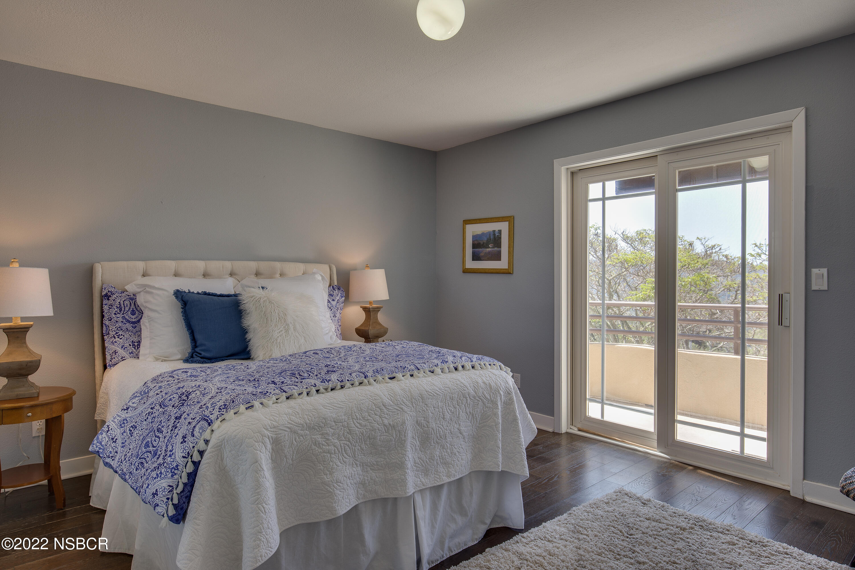 1833 Cougar Ridge Road Buellton, CA 93427 - Photo 27 of 46 a bedroom with a large bed and a large window