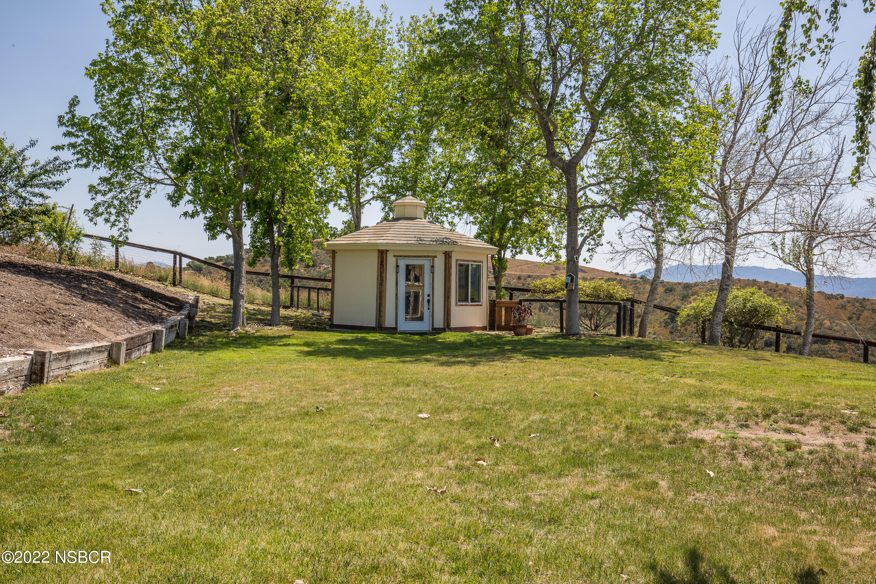1833 Cougar Ridge Road Buellton, CA 93427 - Photo 36 of 46 a front view of a house with a garden