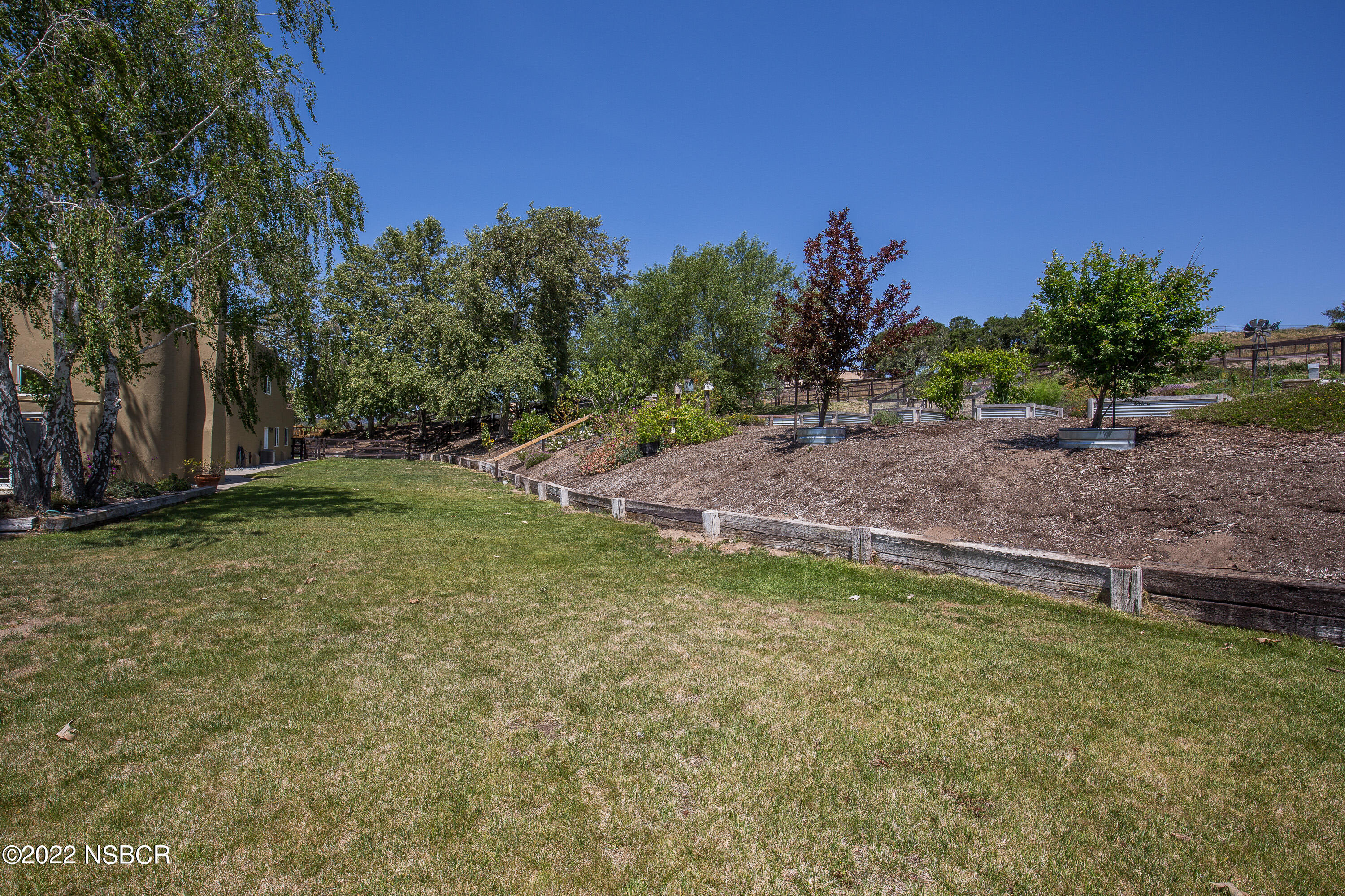 1833 Cougar Ridge Road Buellton, CA 93427 - Photo 43 of 46 a backyard of a house with lots of green space