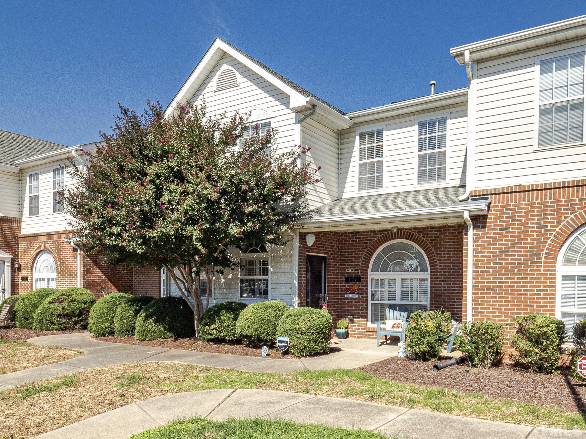 2031 Rivergate Road, Unit 106 Raleigh, NC 27614 - Photo 1 of 11 a front view of a house with a yard