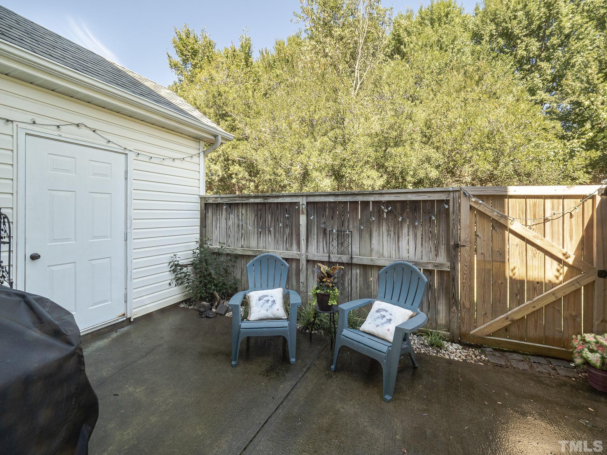 2031 Rivergate Road, Unit 106 Raleigh, NC 27614 - Photo 4 of 11 a view of backyard with outdoor seating and trees