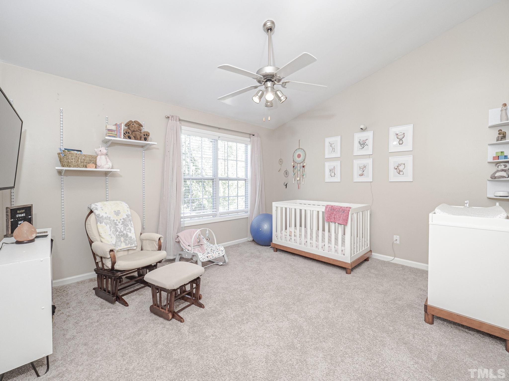 2031 Rivergate Road, Unit 106 Raleigh, NC 27614 - Photo 7 of 11 a living room with furniture and a table