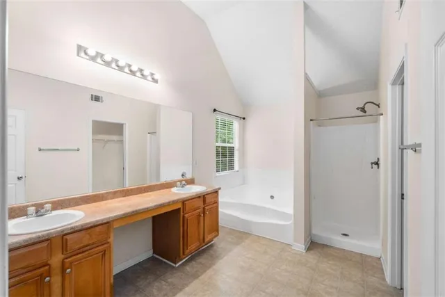 a room with a sink and a mirror