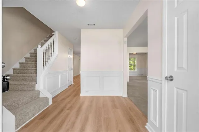 a view of a hallway view with staircase