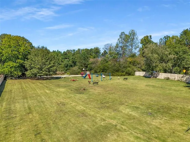 a view of a swimming pool with an outdoor space and seating area