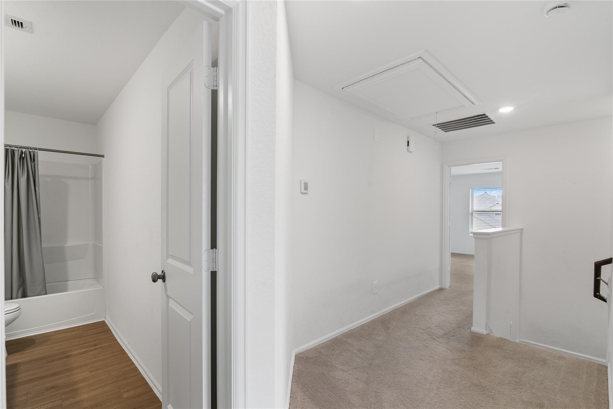 3034 Twisted Myrtle Drive Conroe, TX 77301 - Photo 12 of 27 a view of a hallway with wooden floor and closet area