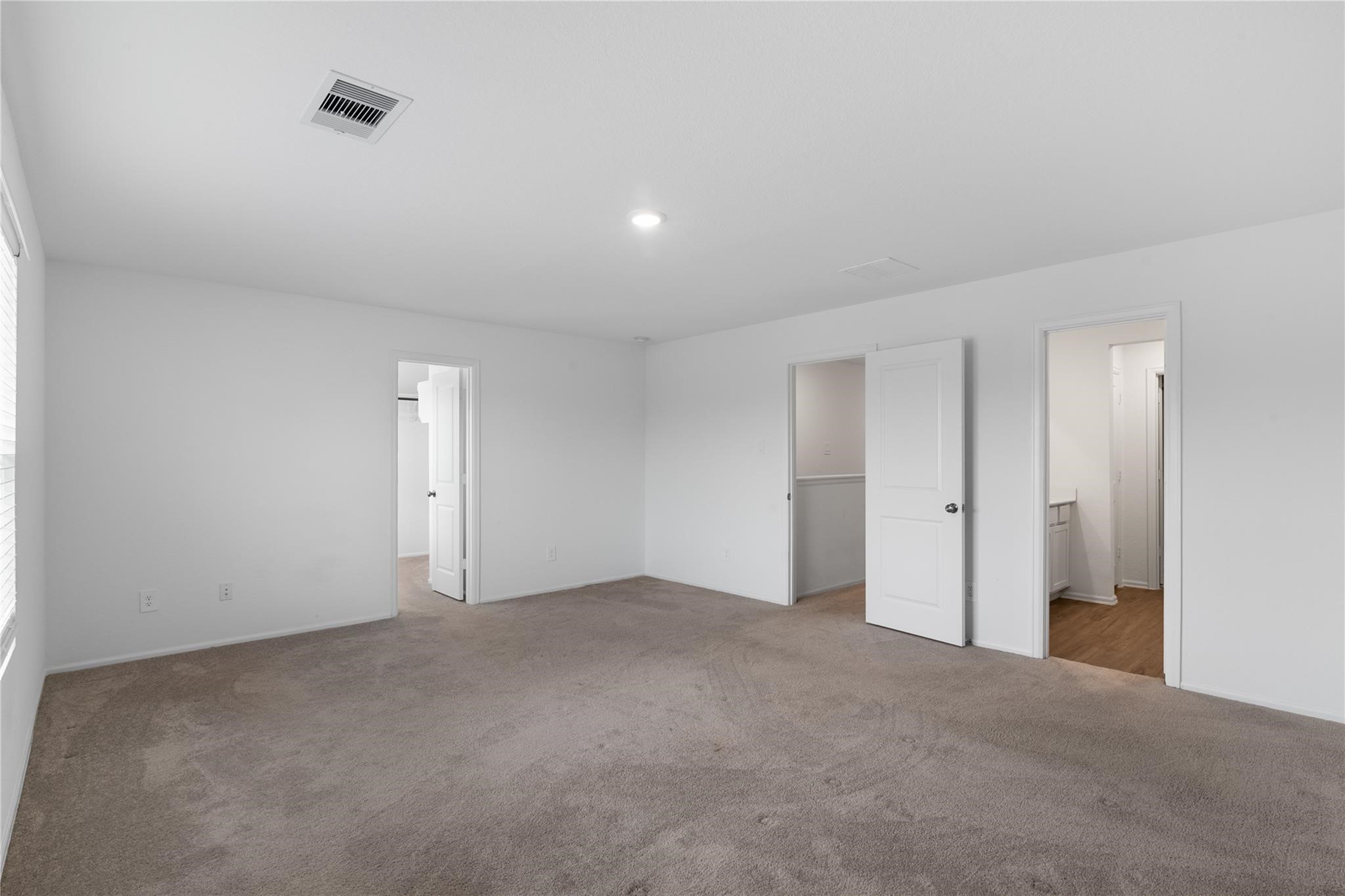 3034 Twisted Myrtle Drive Conroe, TX 77301 - Photo 13 of 27 a view of an empty room and chandelier fan