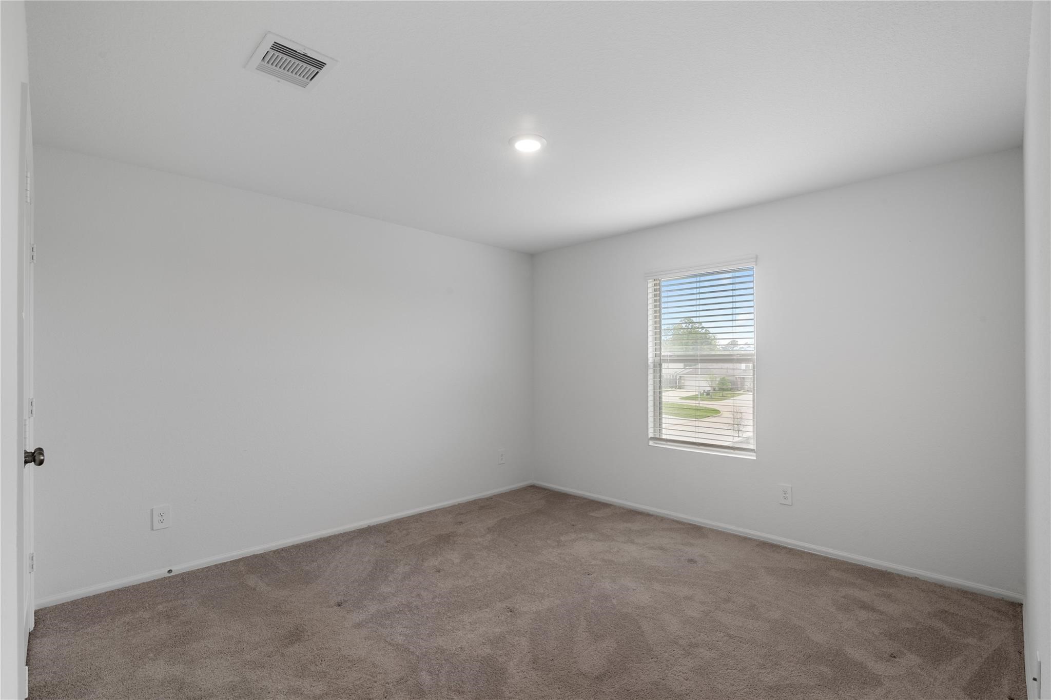 3034 Twisted Myrtle Drive Conroe, TX 77301 - Photo 19 of 27 an empty room with windows