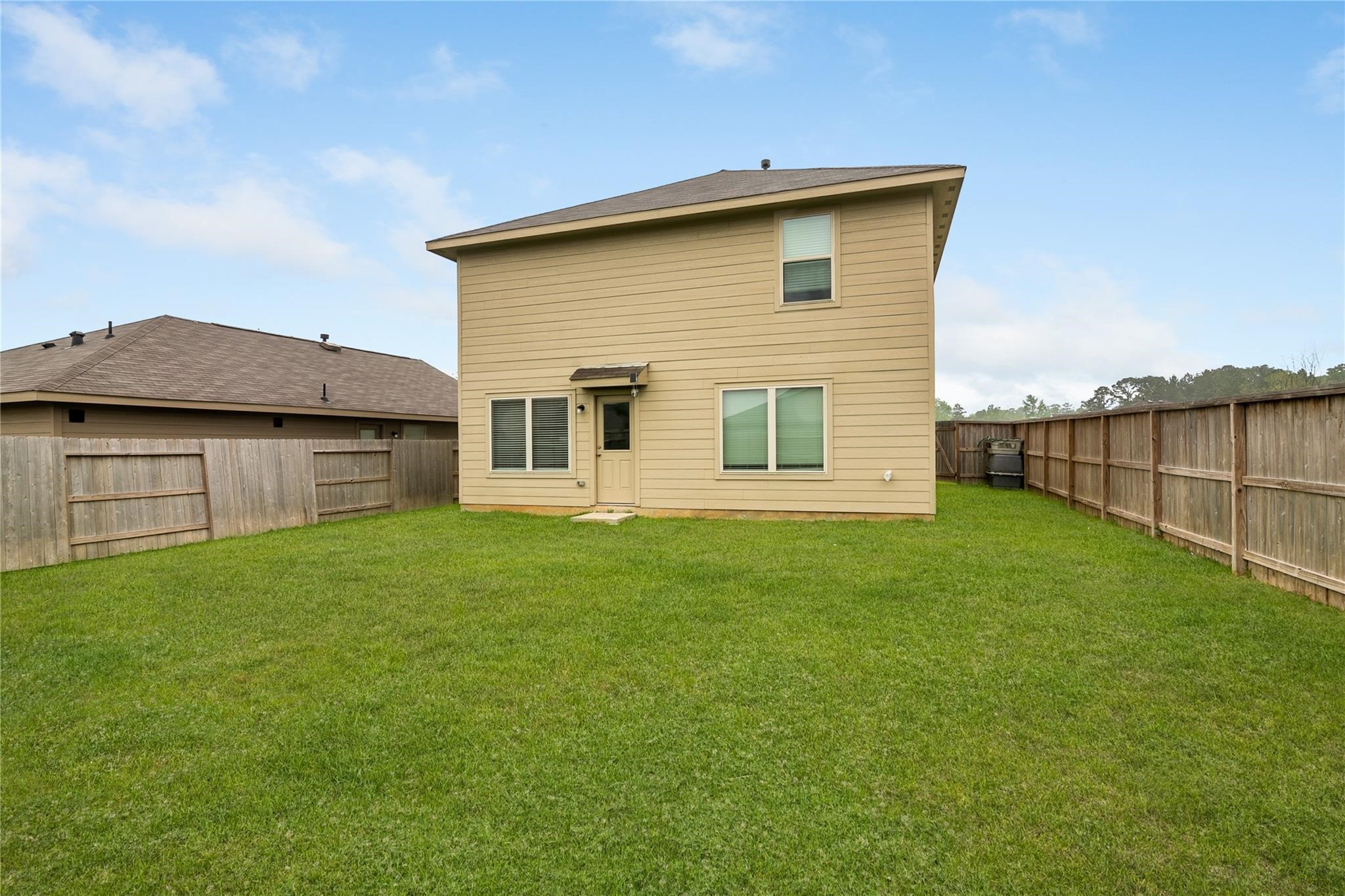 3034 Twisted Myrtle Drive Conroe, TX 77301 - Photo 23 of 27 a view of a backyard with a garden