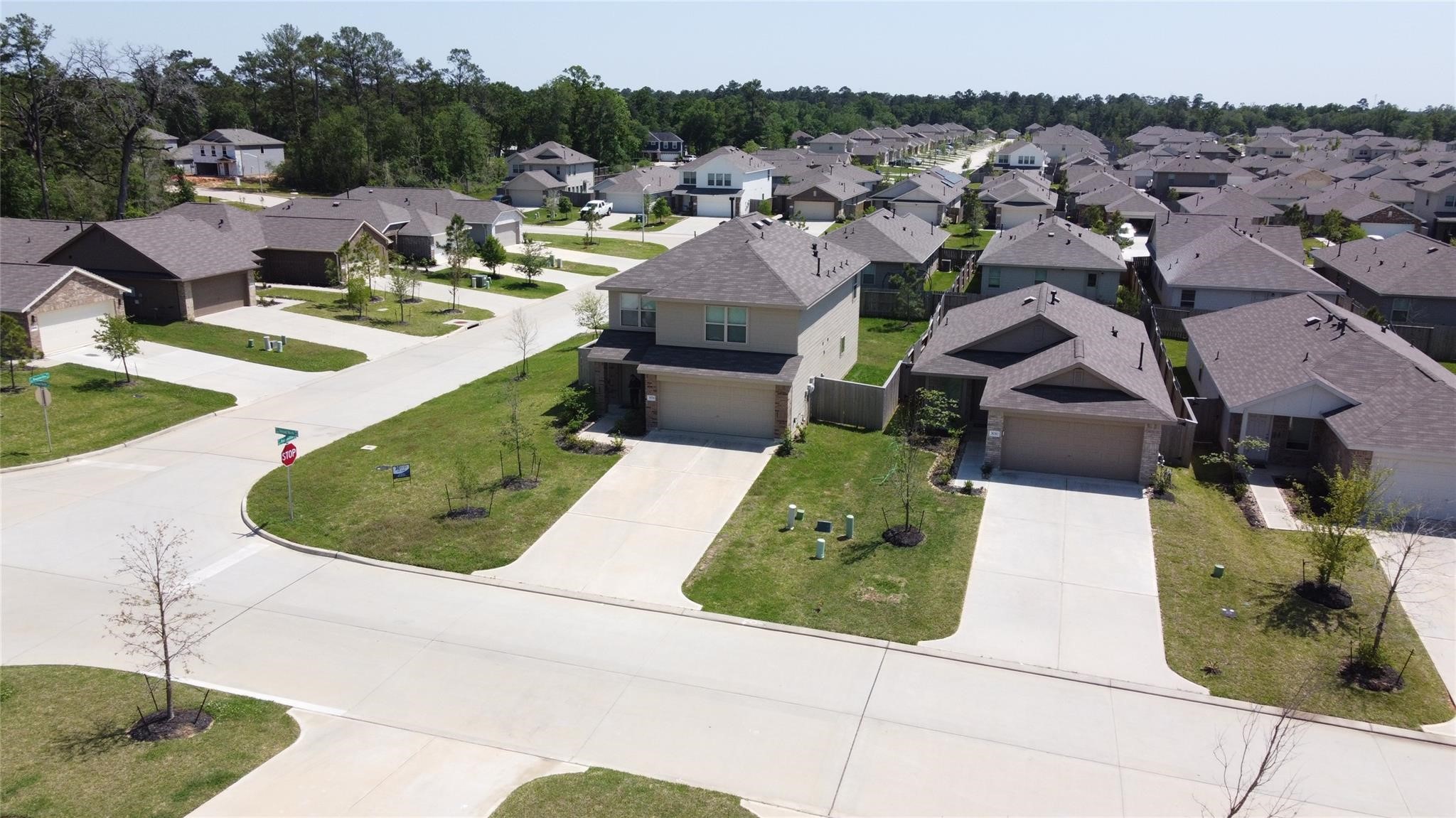 3034 Twisted Myrtle Drive Conroe, TX 77301 - Photo 25 of 27 an aerial view of a house with garden space and street view