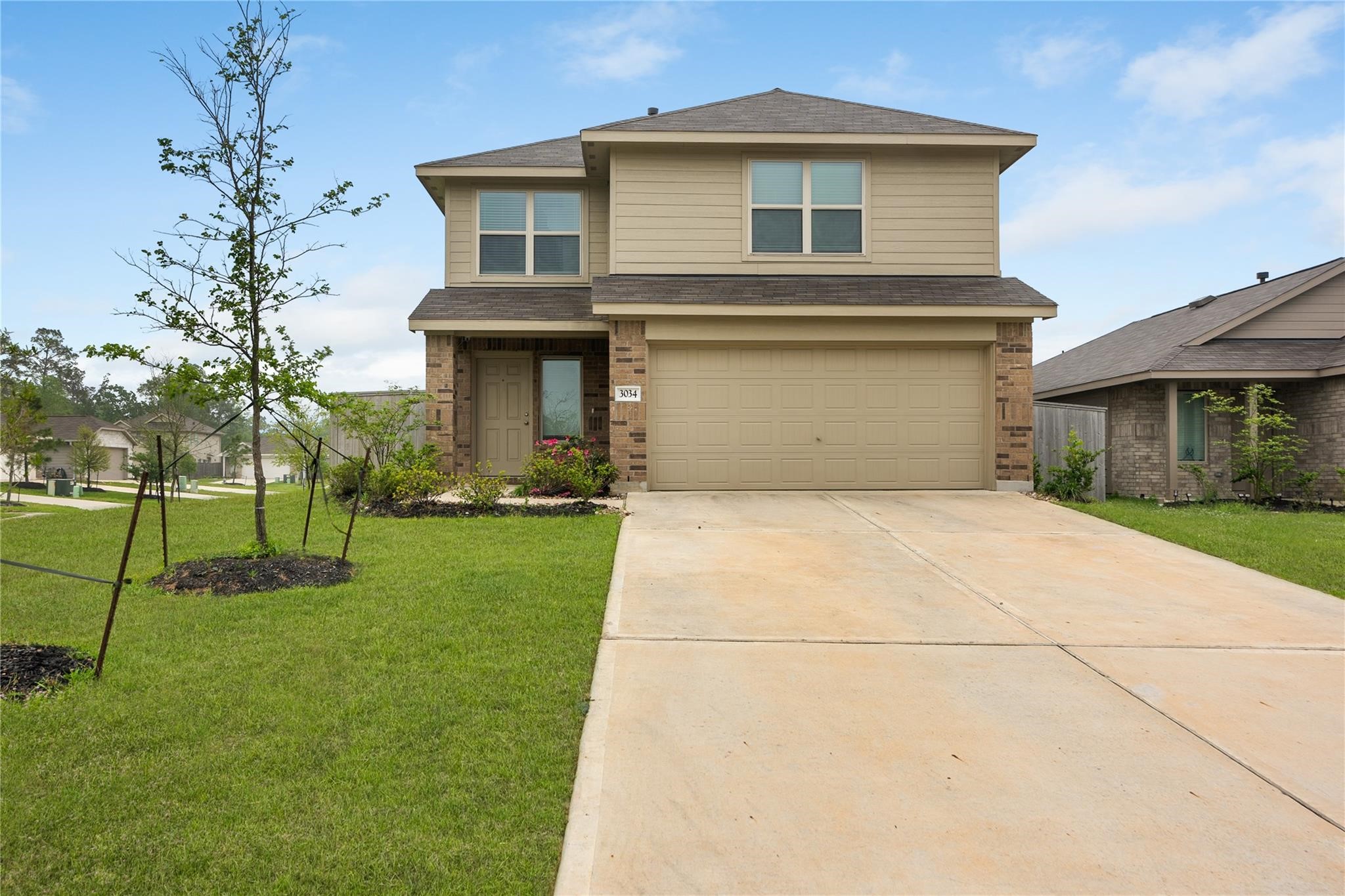 3034 Twisted Myrtle Drive Conroe, TX 77301 - Photo 27 of 27 a house view with a garden space