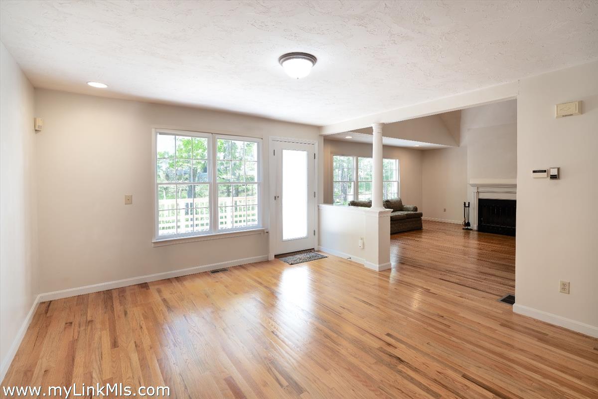 261 Sandpiper Lane, Unit 12 Vineyard Haven, MA 02568 - Photo 12 of 50 a view of empty room with wooden floor and window