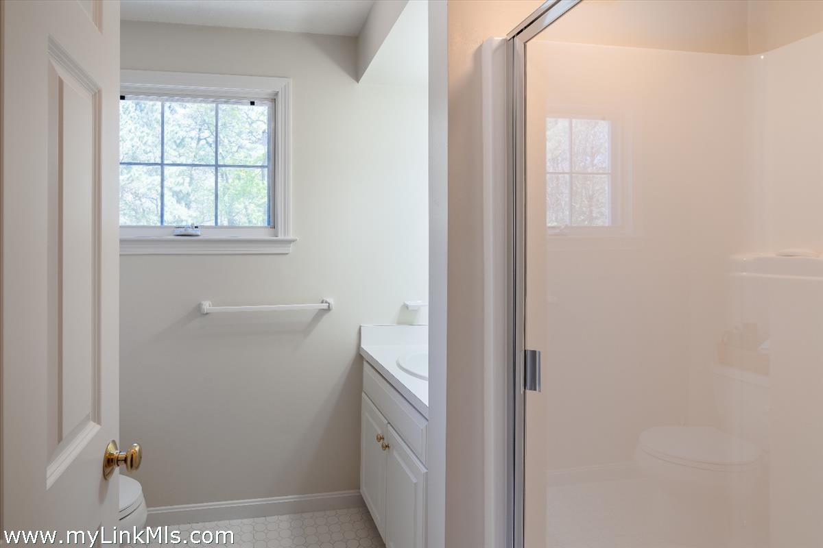261 Sandpiper Lane, Unit 12 Vineyard Haven, MA 02568 - Photo 29 of 50 a bathroom with a window