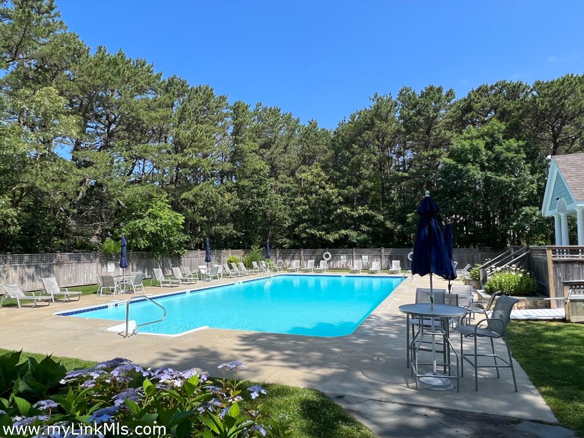 261 Sandpiper Lane, Unit 12 Vineyard Haven, MA 02568 - Photo 36 of 50 a view of a swimming pool with a patio