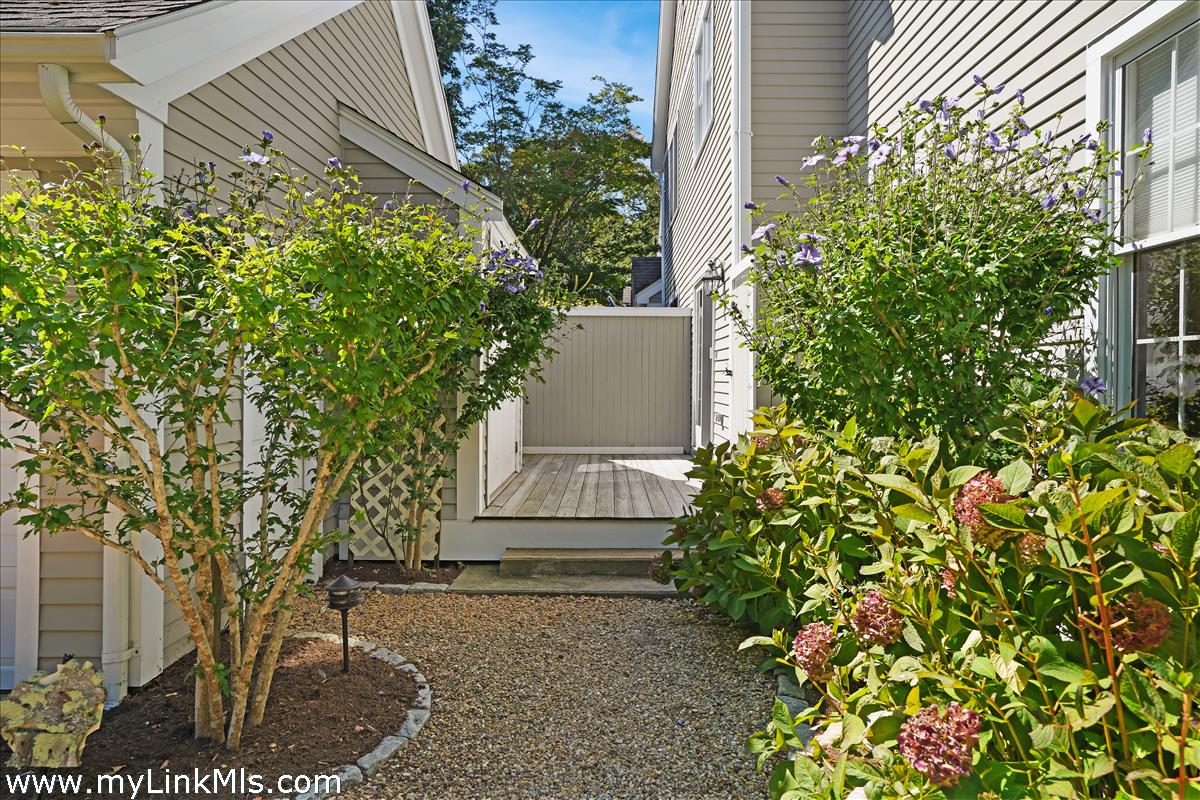 261 Sandpiper Lane, Unit 12 Vineyard Haven, MA 02568 - Photo 5 of 50 a view of a house with a tree