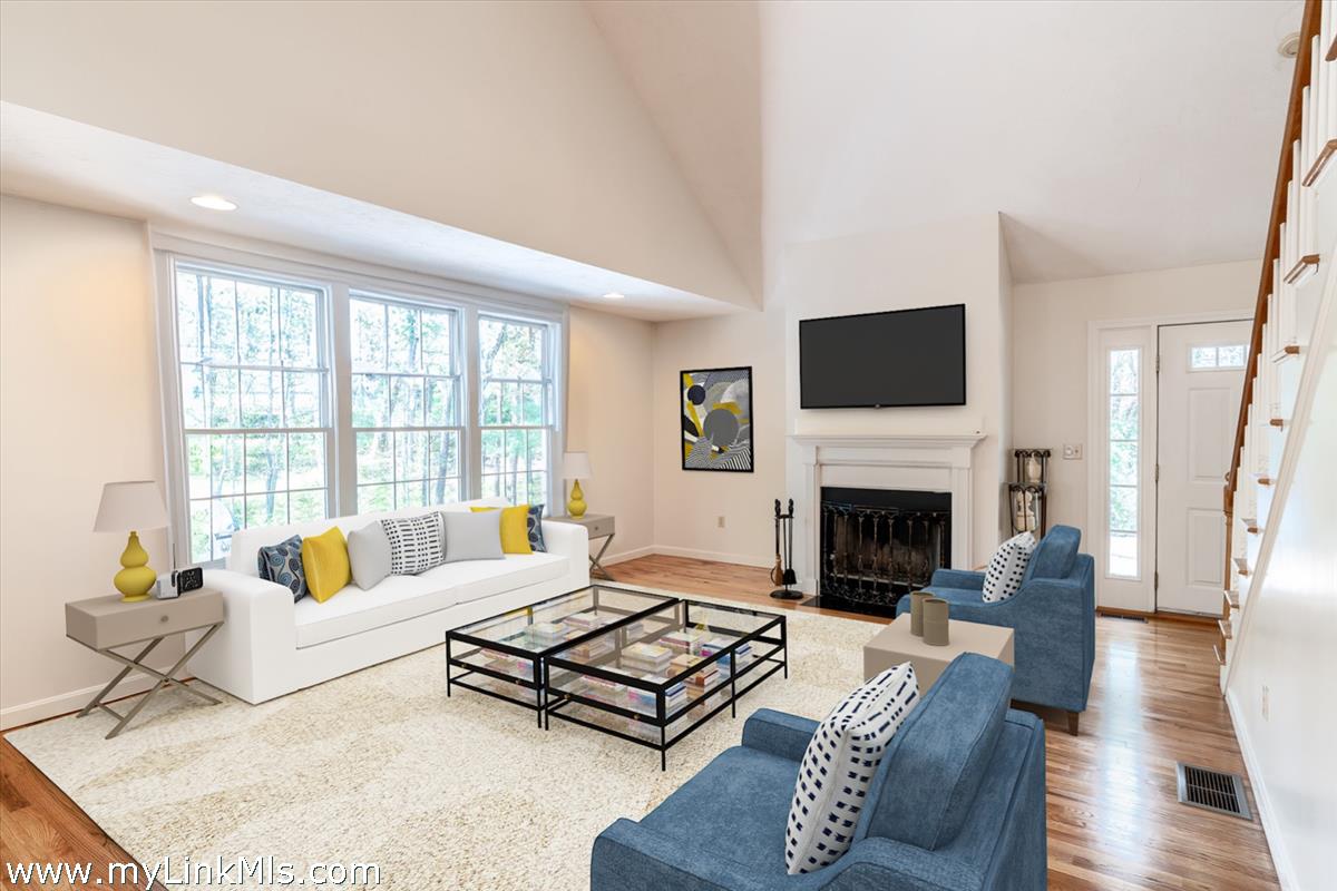 261 Sandpiper Lane, Unit 12 Vineyard Haven, MA 02568 - Photo 6 of 50 a living room with furniture fireplace and a flat screen tv