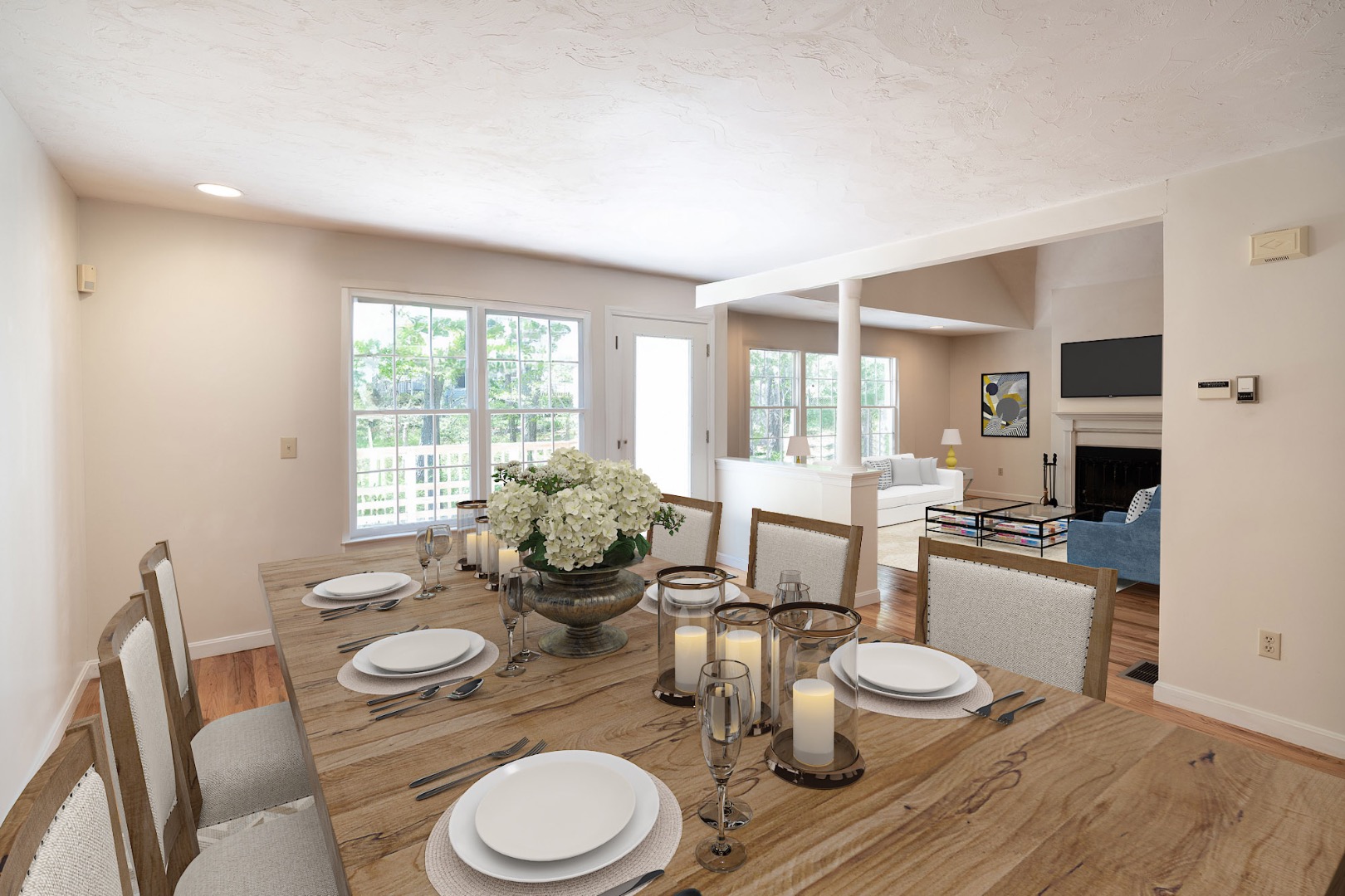 261 Sandpiper Lane, Unit 12 Vineyard Haven, MA 02568 - Photo 7 of 50 a dining room with furniture a large window and wooden floor