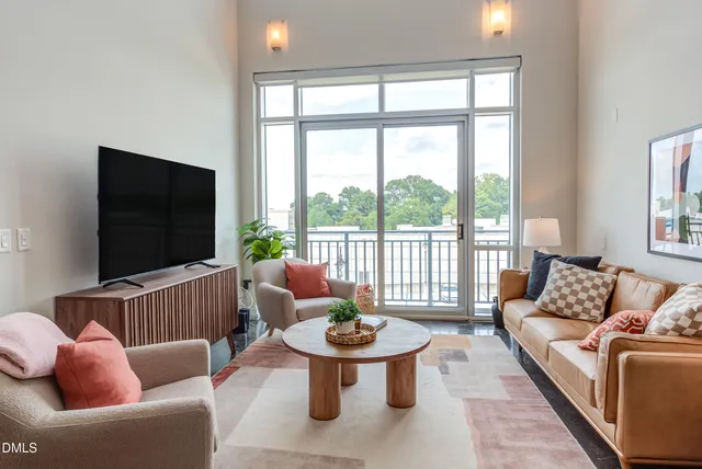a living room with furniture and a large window