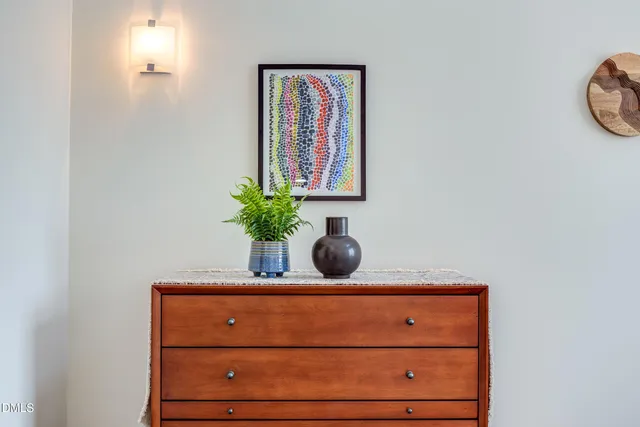 a bedroom with a bed and glass window