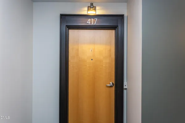 a view of room with furniture and wooden floor