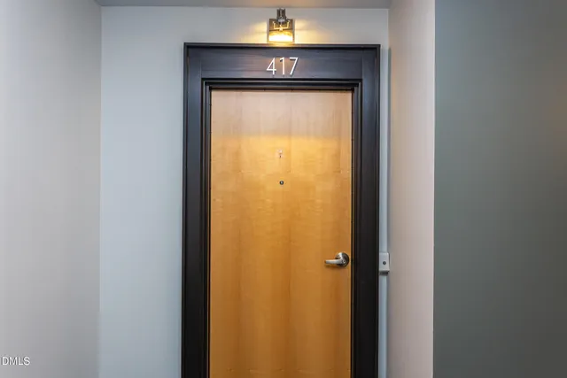 a view of room with furniture and wooden floor